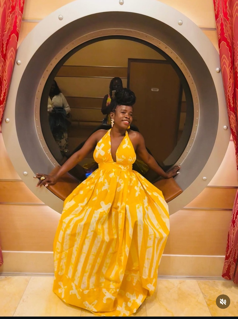 A flowing golden batik halter gown, made by Minnie